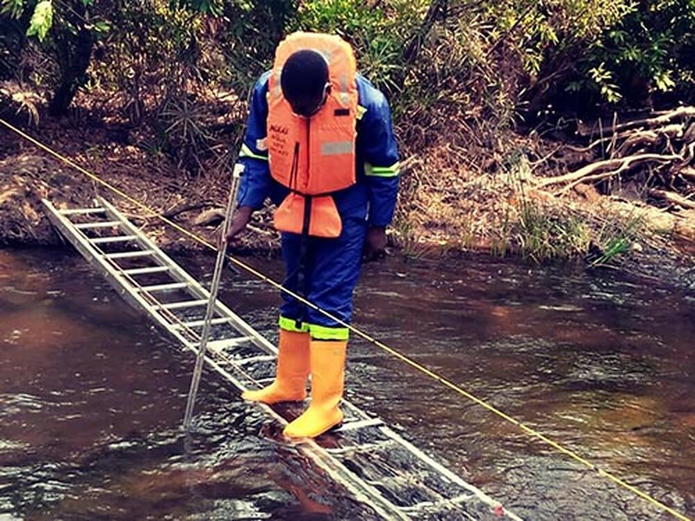 EWES expert measuring the flow of a river
